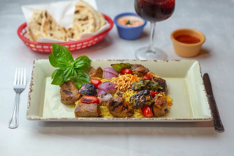Lamb entree with curry and garlic topped with cherry tomatoes