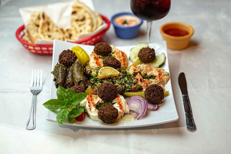 Includes falafel, hummus, grape leaves, tabouleh and baba ganoush entree